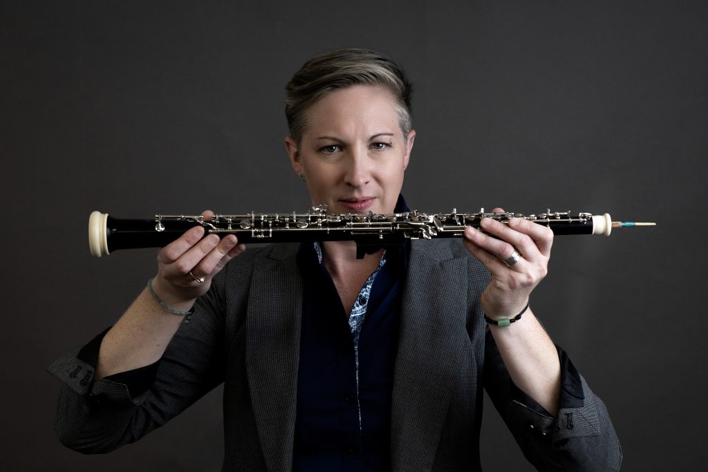 person holding oboe